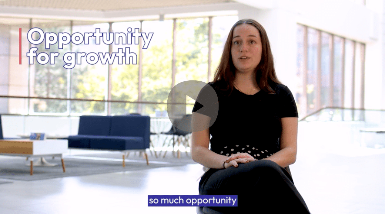 young woman sitting in the lobby of an insurance company discussing his experience of working there